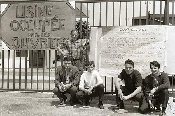 french workers with placard during occupation of their factory