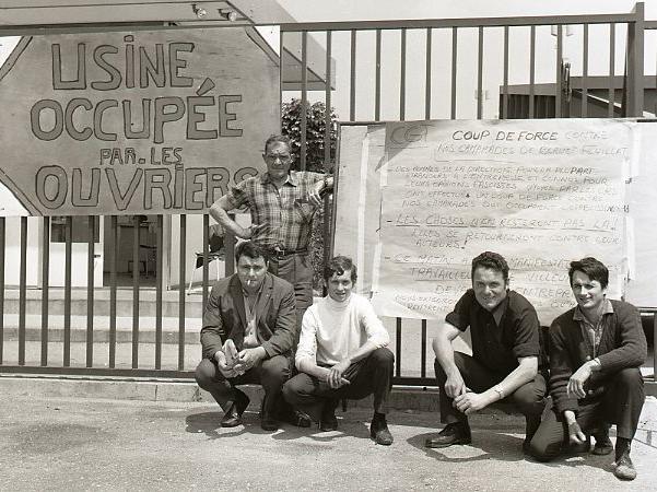 French workers with placard during occupation of their factory