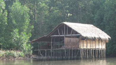 A structure on stilts in water. 